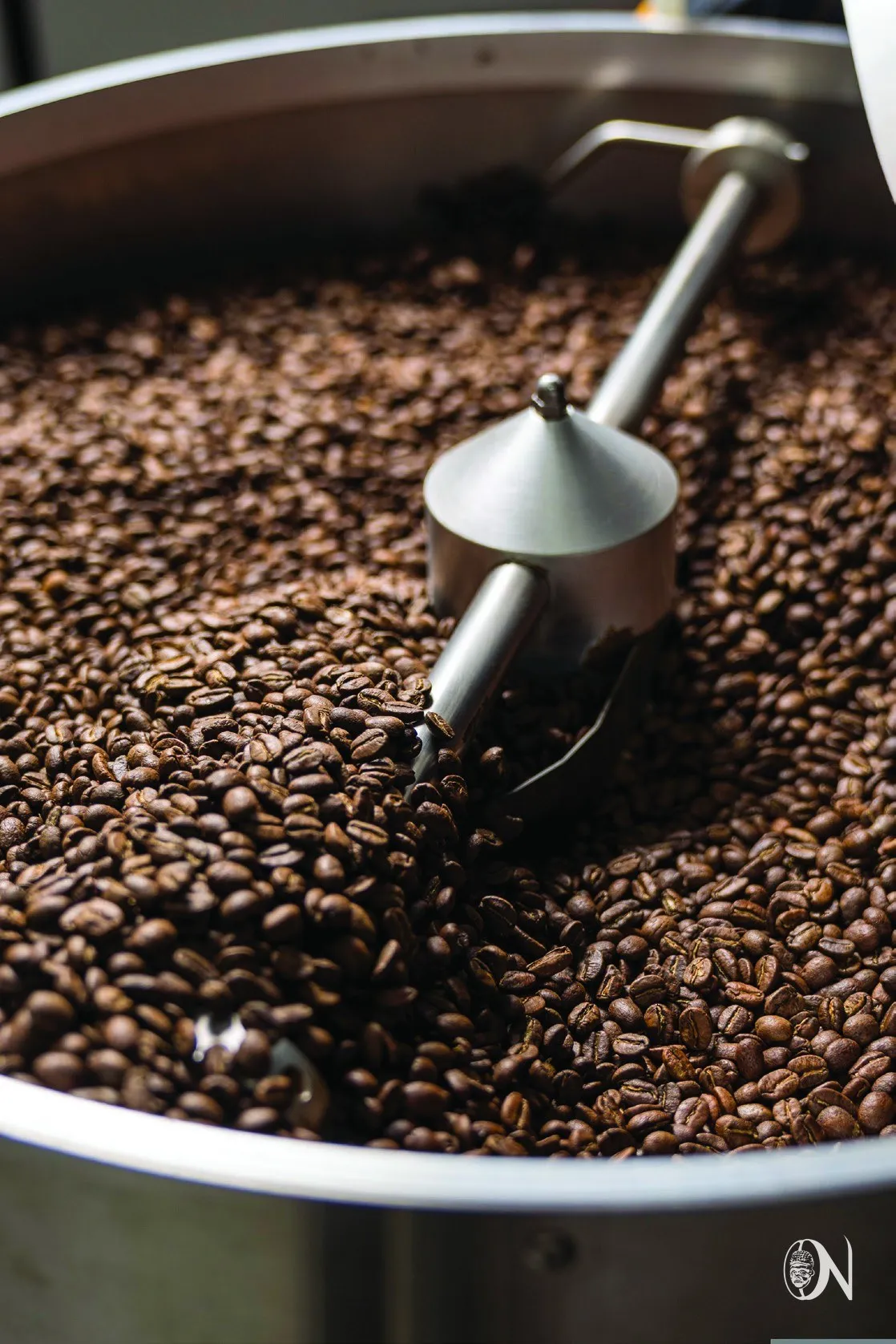 Freshly roasted beans turning in the cooling tray
